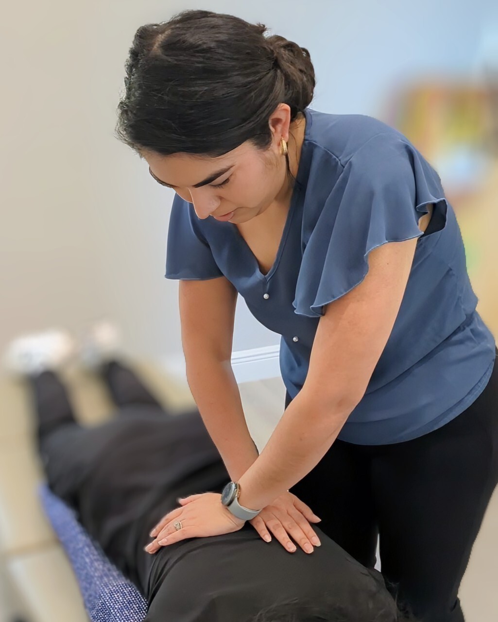 Dr. Crystal Corona performing a prenatal chiropractic adjustment at Grounded Wellness in Land O' Lakes, FL