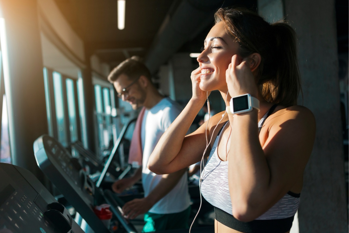 Athlete running on a treadmill during sports recovery training